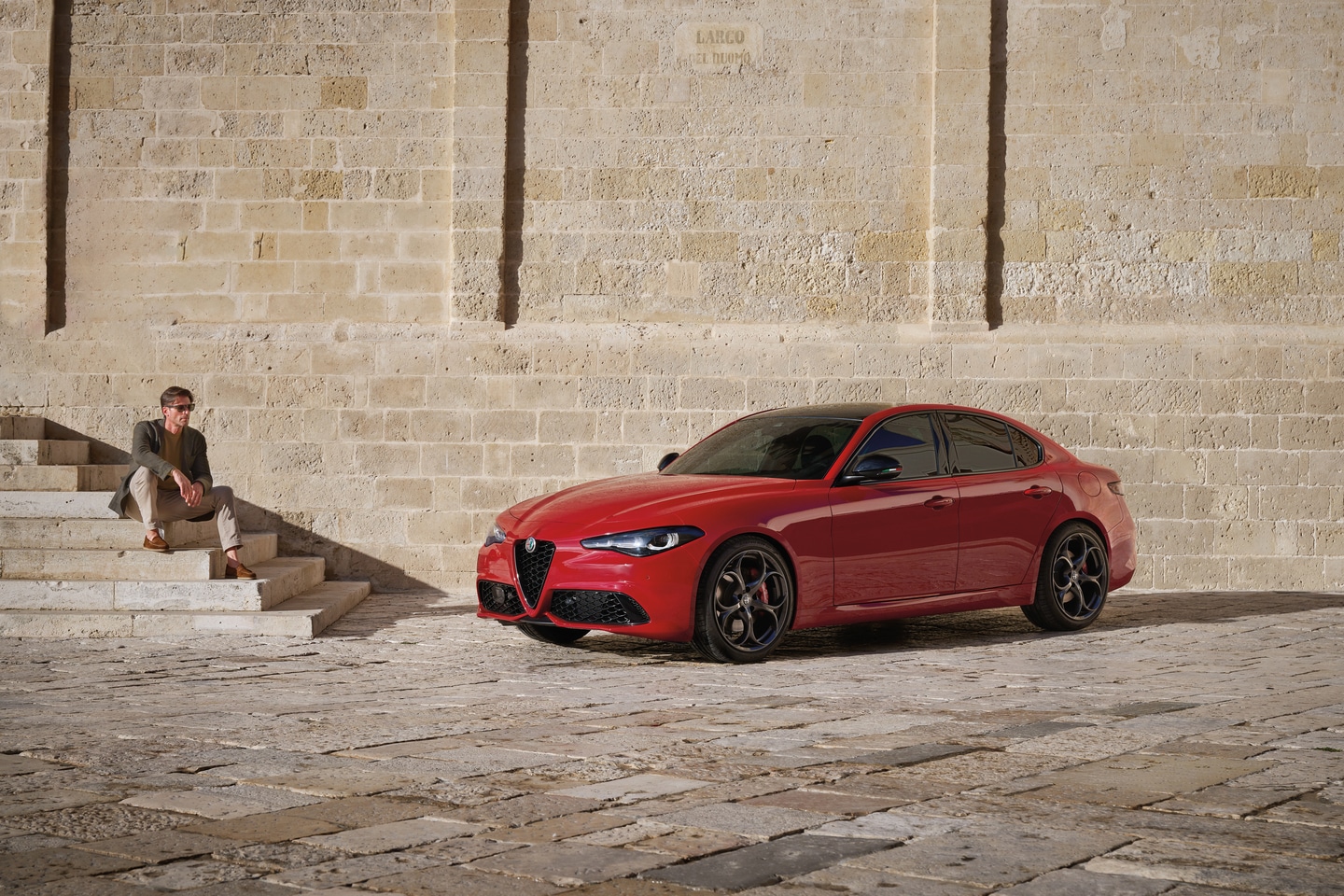  Person cheerfully signing documents.