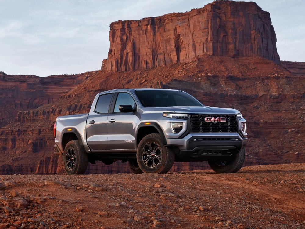  Person cheerfully signing documents.