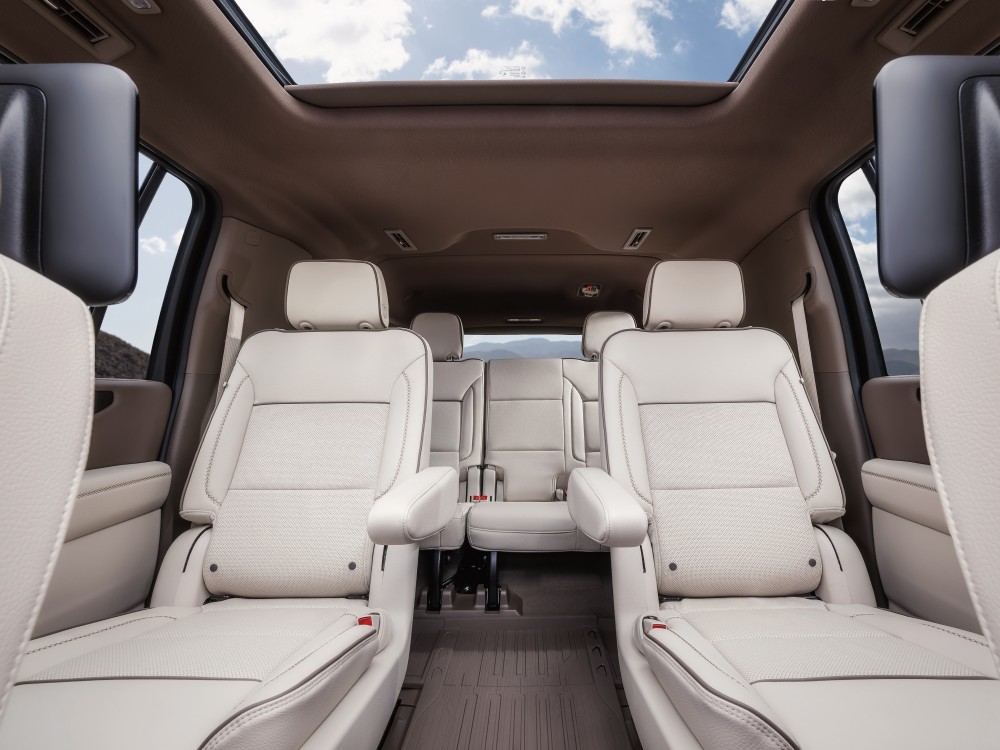  Person cheerfully signing documents.