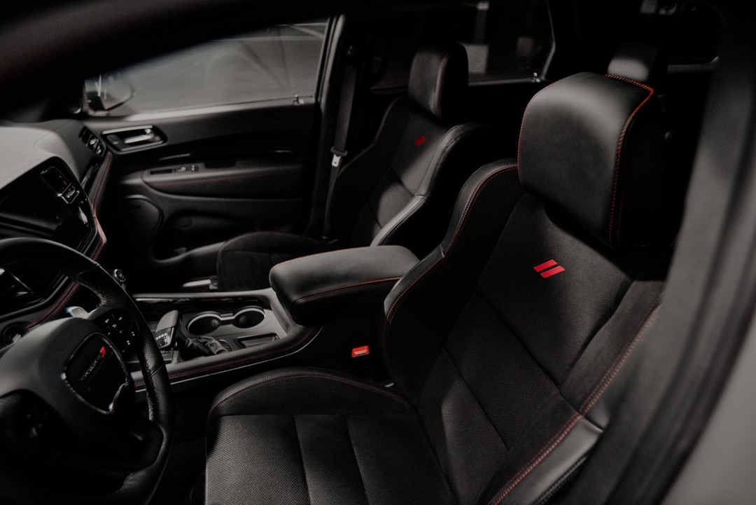  Person cheerfully signing documents.