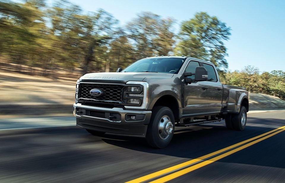  Person cheerfully signing documents.