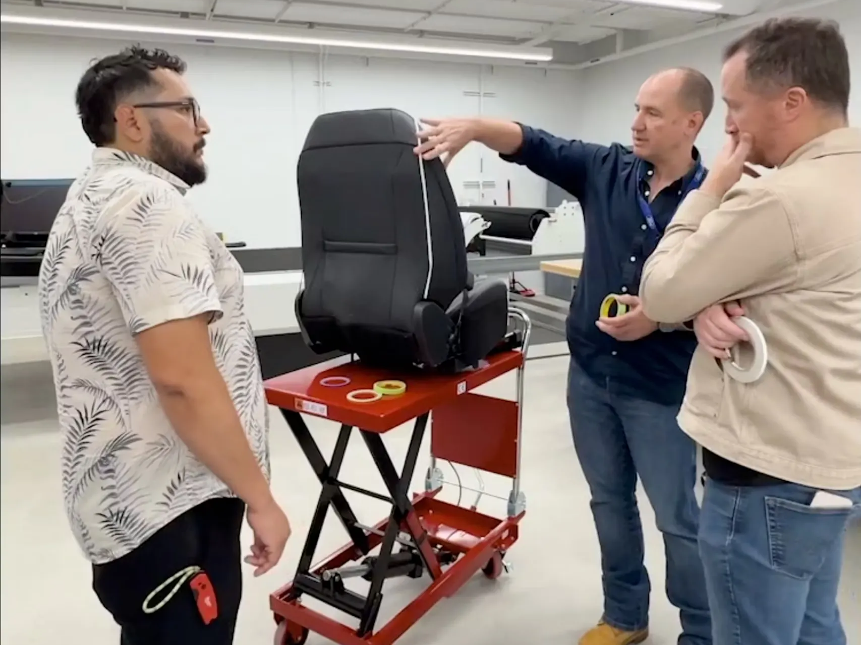 Engineers reviewing a car seat design.