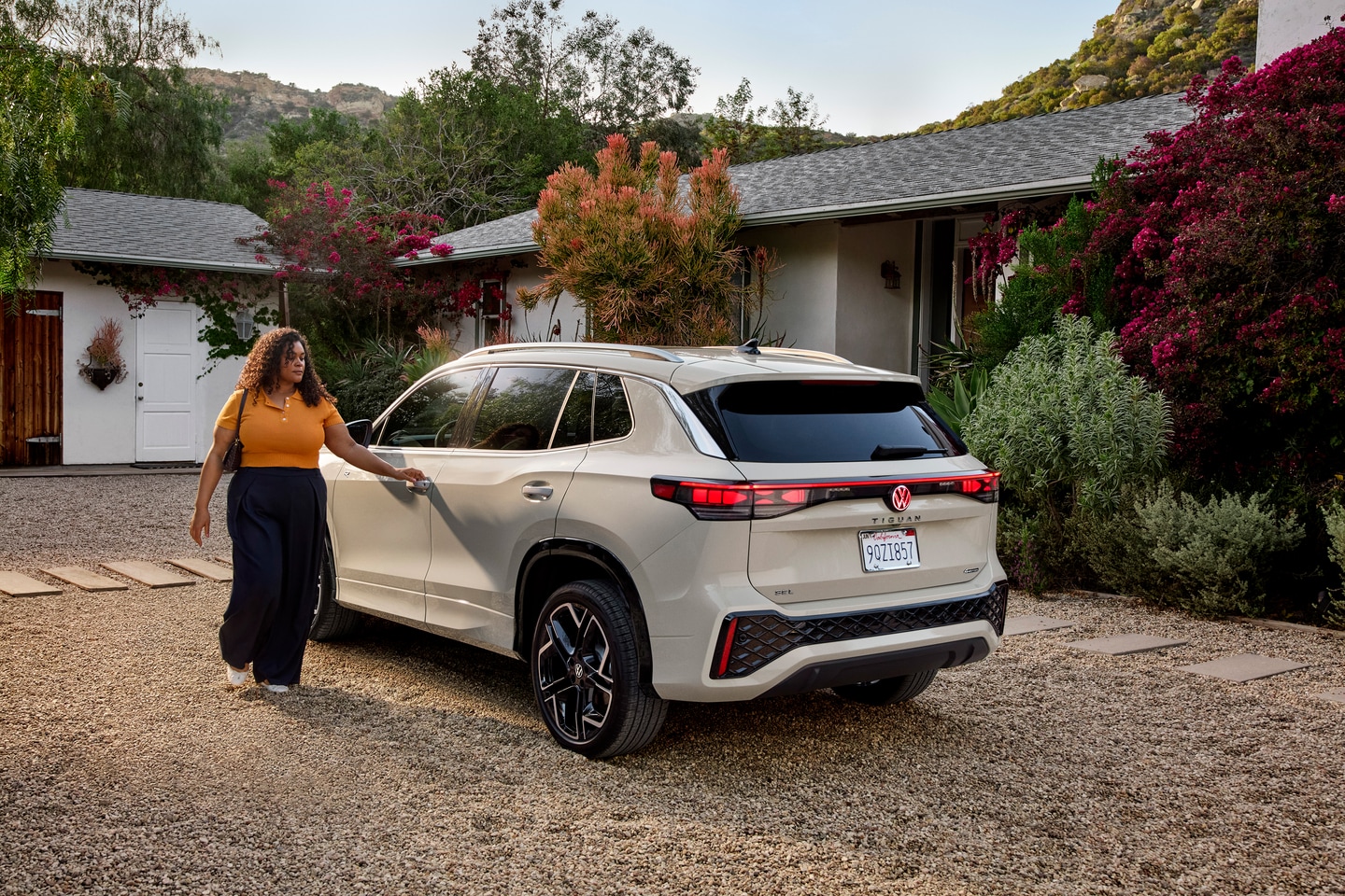  Person cheerfully signing documents.