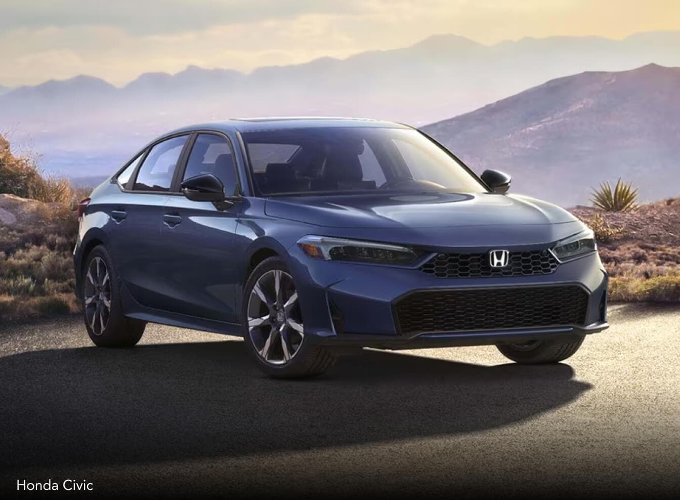 Exterior image of a blue 2026 Honda Civic parked in a mountainside parking lot at dusk.
