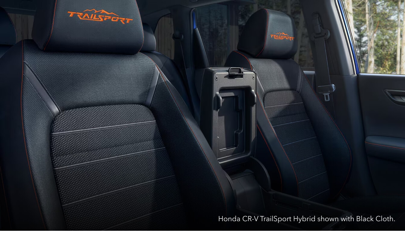 Close-up interior view of the front bucket seats featuring a Honda CR-V TrailSport Hybrid with Black Cloth interior.