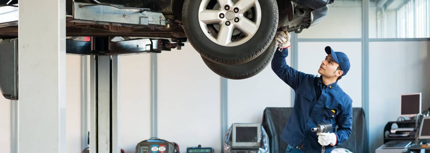 Service Technician Working Under Vehicle