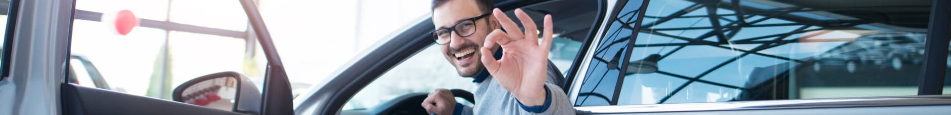 Customer recieving keys to new Honda vehicle and jumping into the driver seat