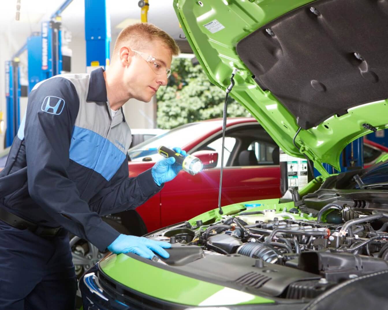 Technician working under the hood