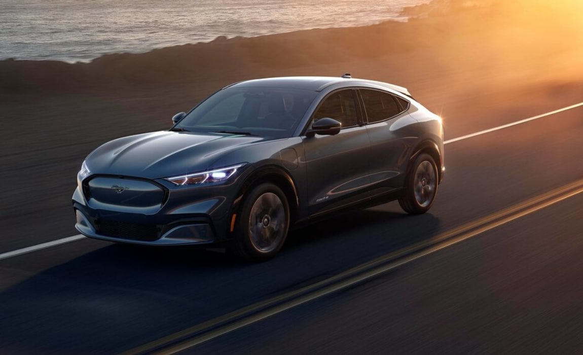 2021 Ford Mustang Mach-E exterior driving open highway sunset