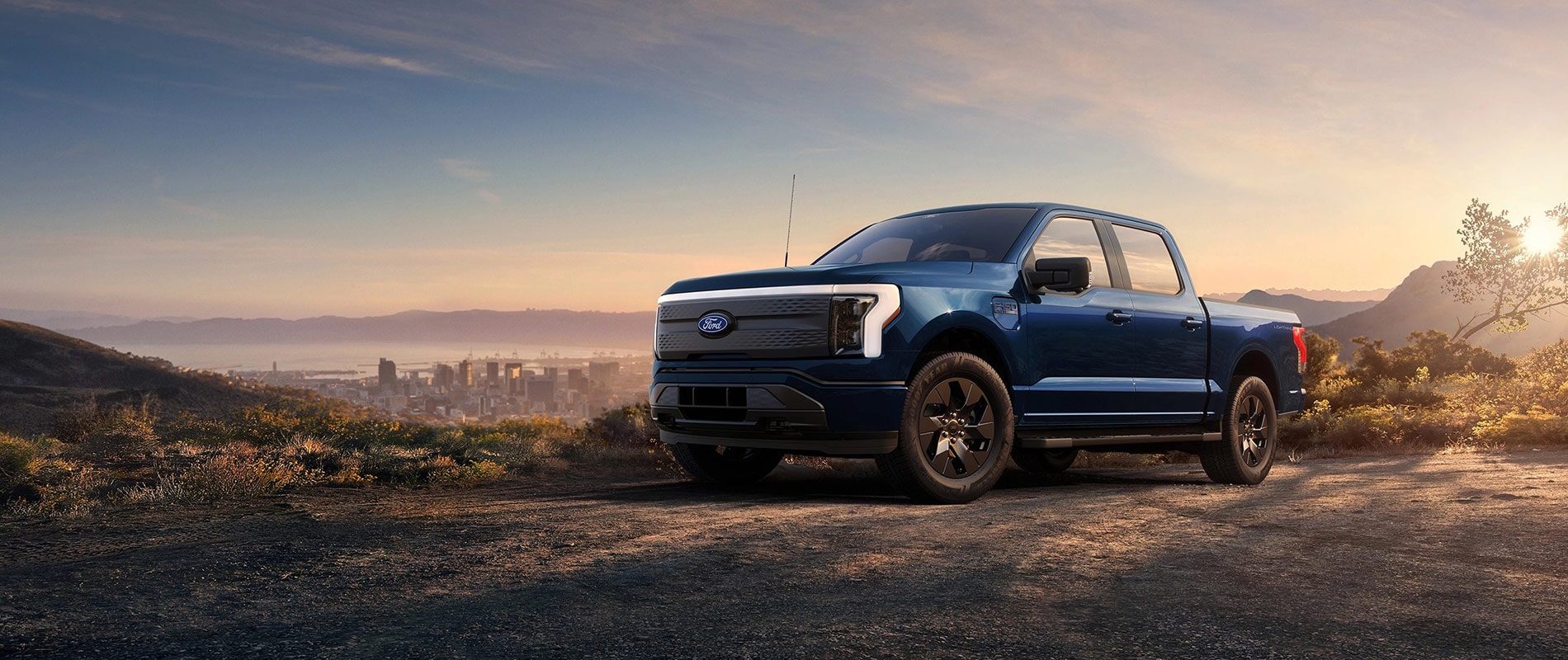 Ford Dealer Near Denver, CO Ford F-150 Lightning parked on a sunlit hill
