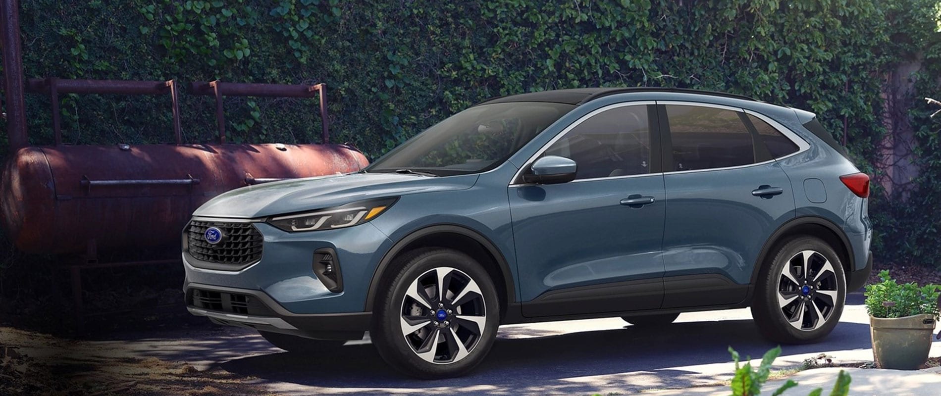 2025 Ford Escape for Sale Near Castle Rock, CO Blue 2025 Ford Escape parked beside an ivy covered wall