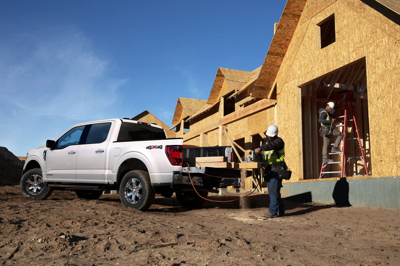 A Ford F-150 parked outside a construction site.