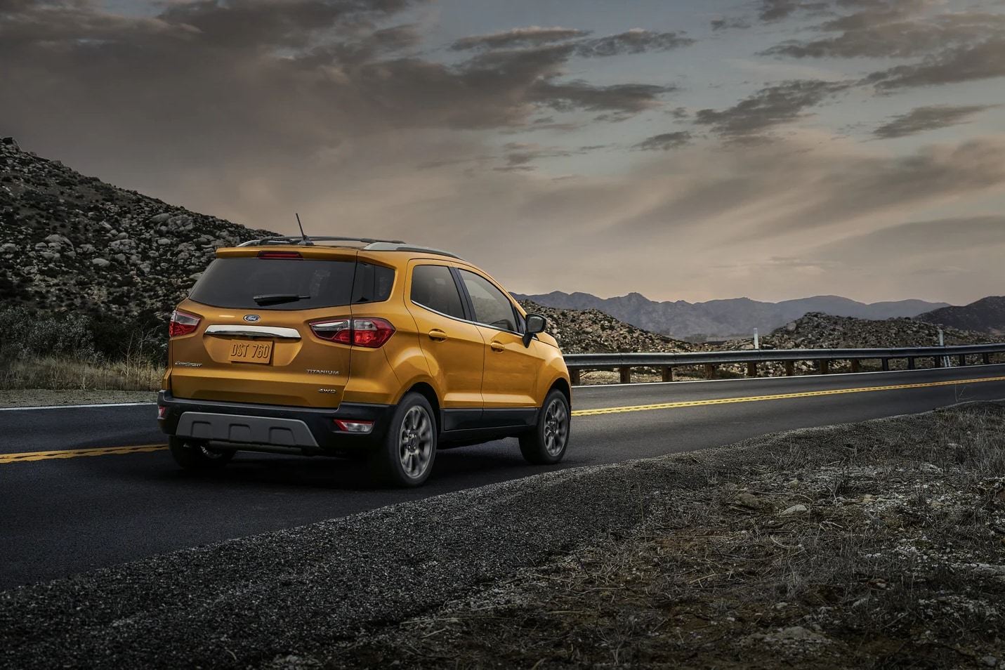 yellow-ford-ecosport-driving-away-through-city-road