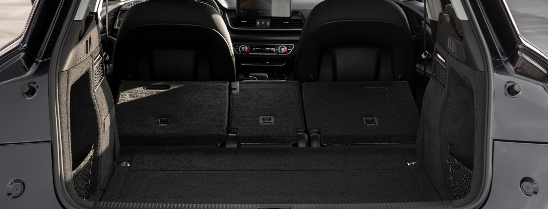 A view of the open hatch and rear cargo space of the 2023 Audi Q5