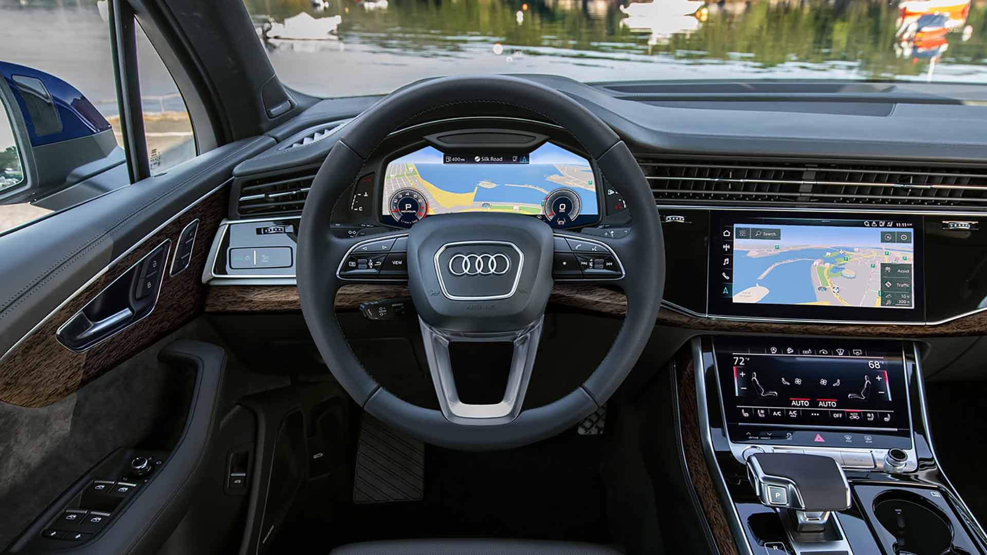 The interior view of a Audi with the Virtual Cockpit being used.