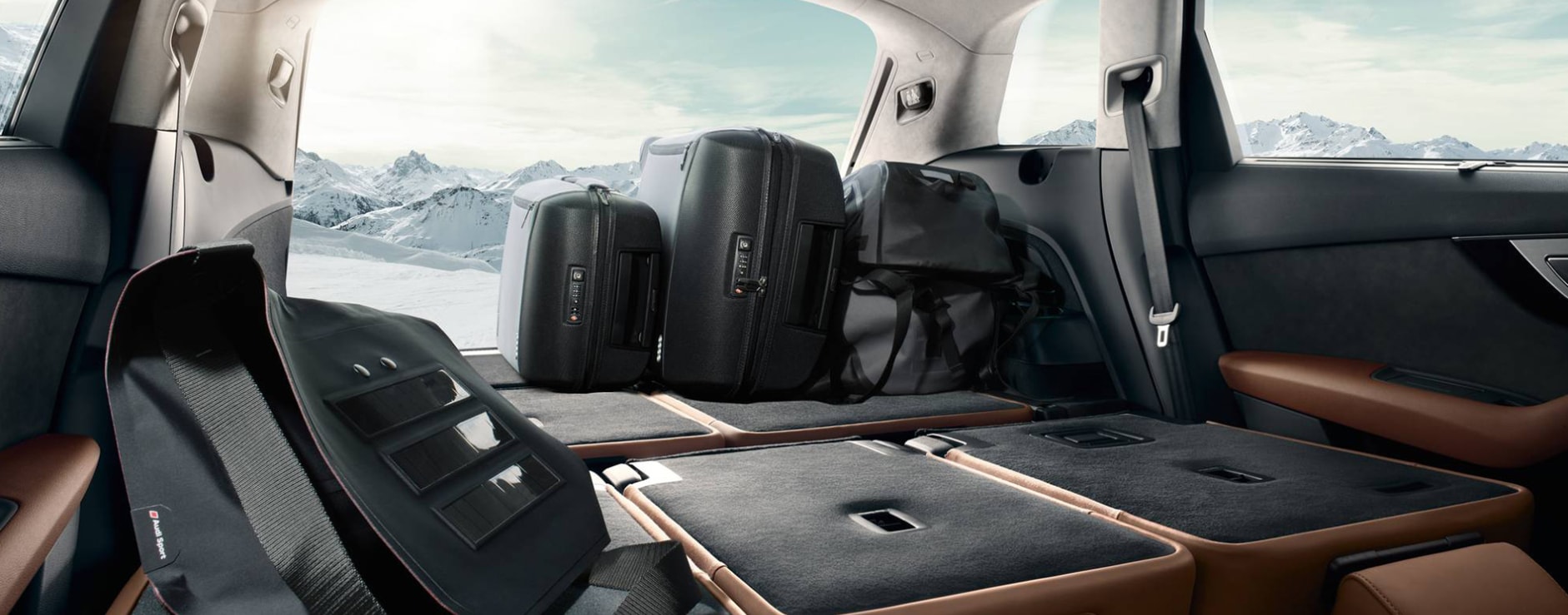 A view of the interior cargo and back seats folded down of a 2023 Audi Q7
