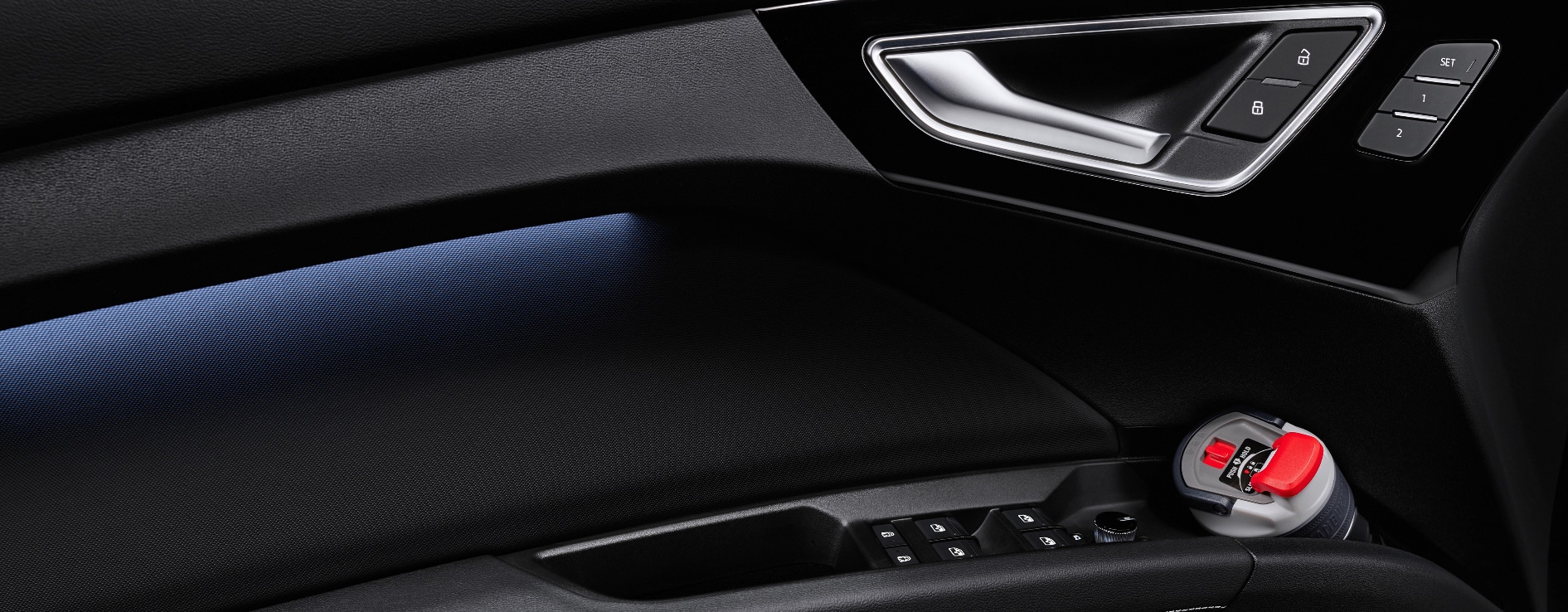 A closeup of the door and interior finishes and lighting of a 2023 Audi Q4 e-tron