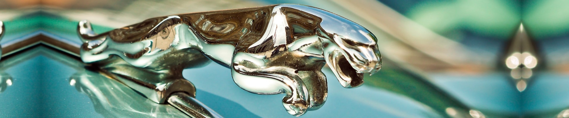 Zoomed in camera angle of the Jaguar Emblem mounted ton the hood of a used Jaguar car