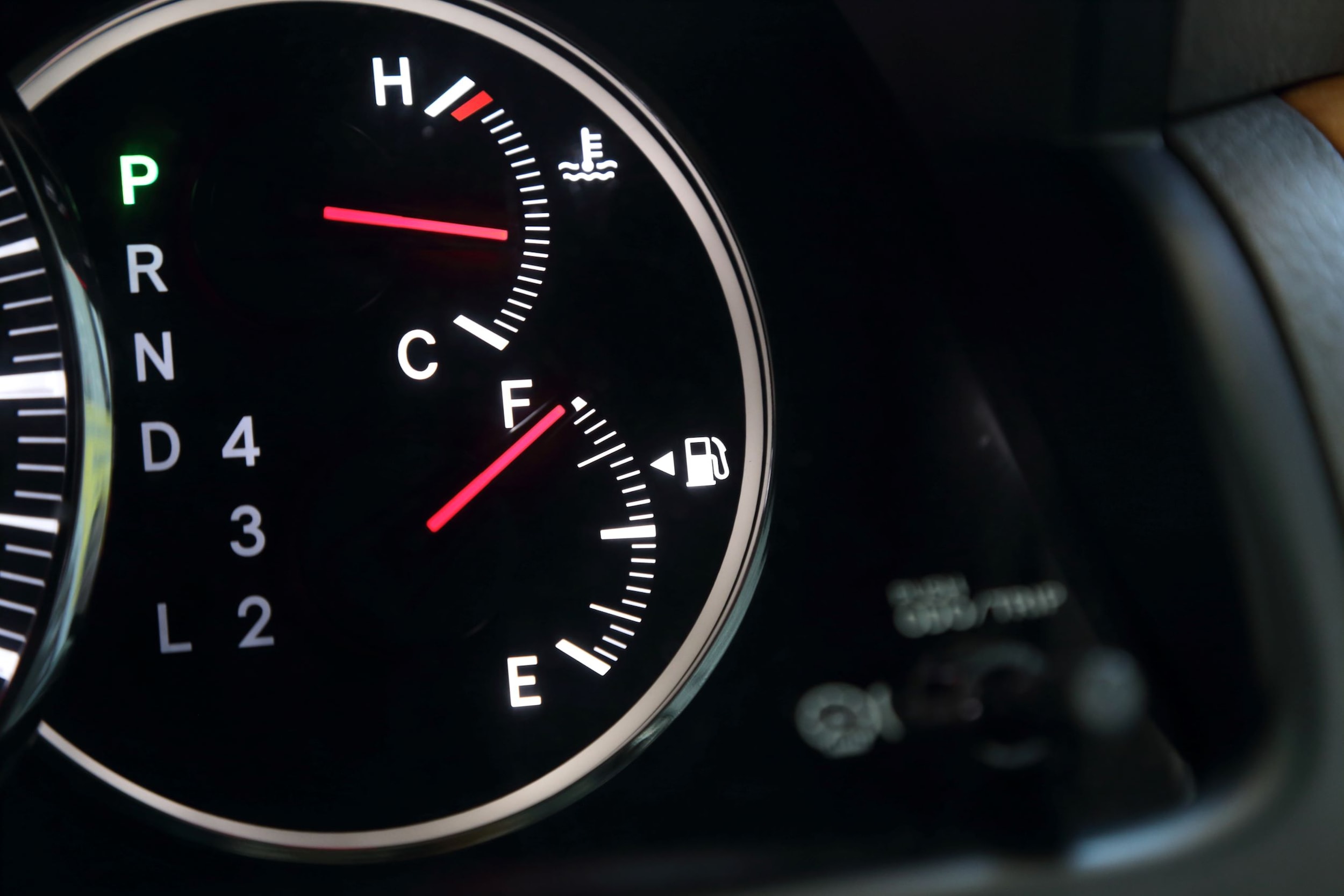 A gasoline gauge showing a full tank.