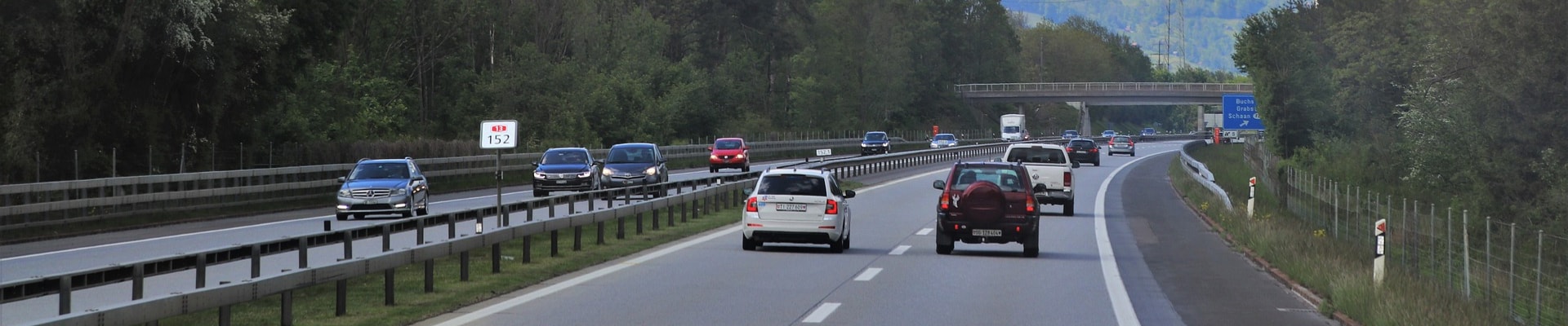 Busy mountain highway of used cars where AWD is needed