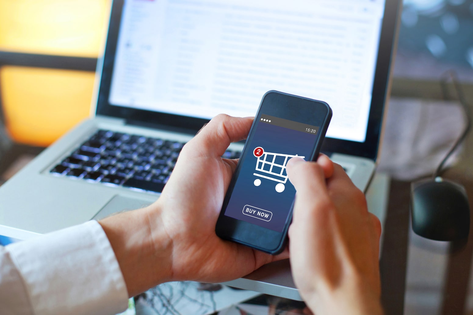 A person using a cell phone to purchase something online
