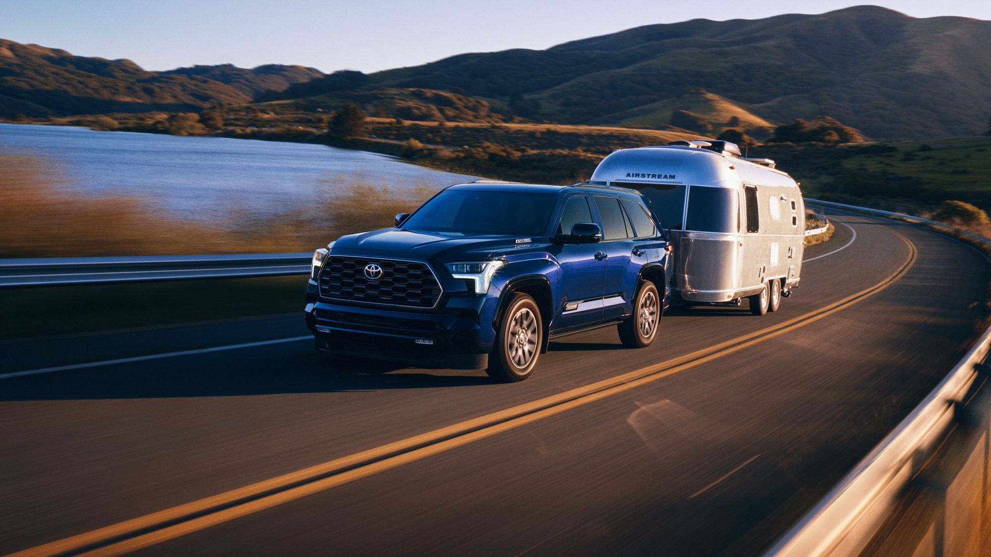 A Toyota Sequoia pulling an Airstream camper.