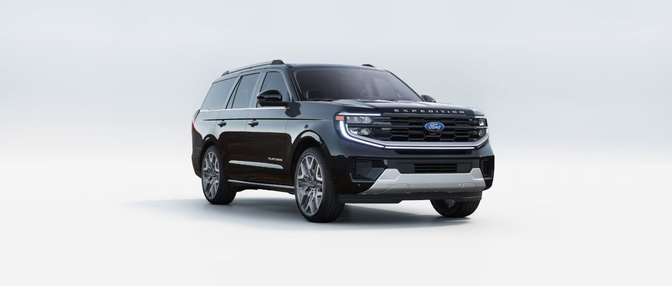 A black 2025 Ford Expedition parked in a bright showroom.