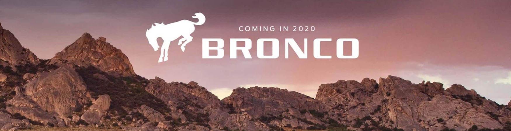 2020 Ford Bronco promotion billboard mountain range Bronco logo in the sky