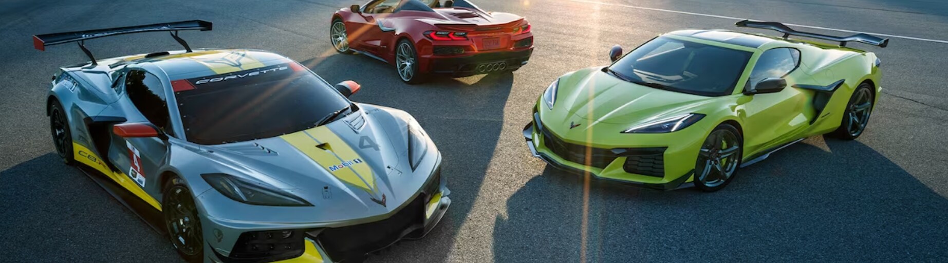 3 2023 Chevy Corvettes sit parked at different angles