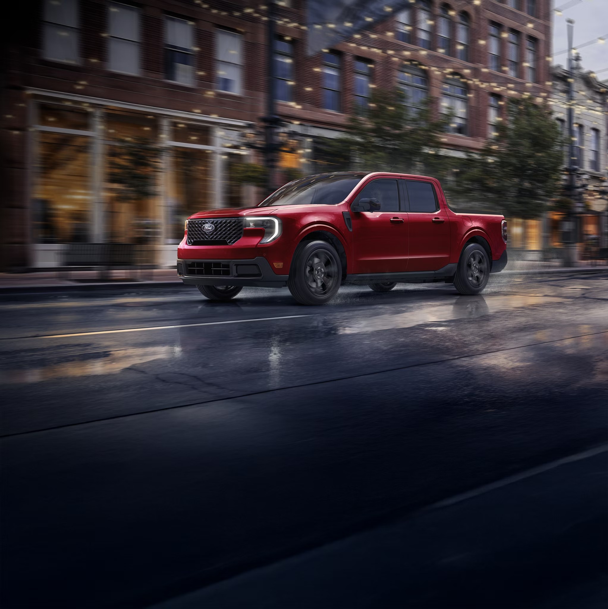 Red 2026 Ford Maverick driving down a city street