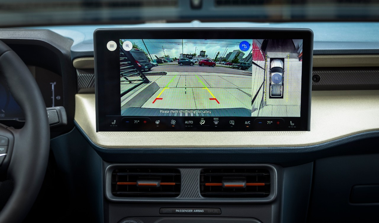 The dashboard screen showing the backup camera and other safety features of the 2025 Ford Maverick.