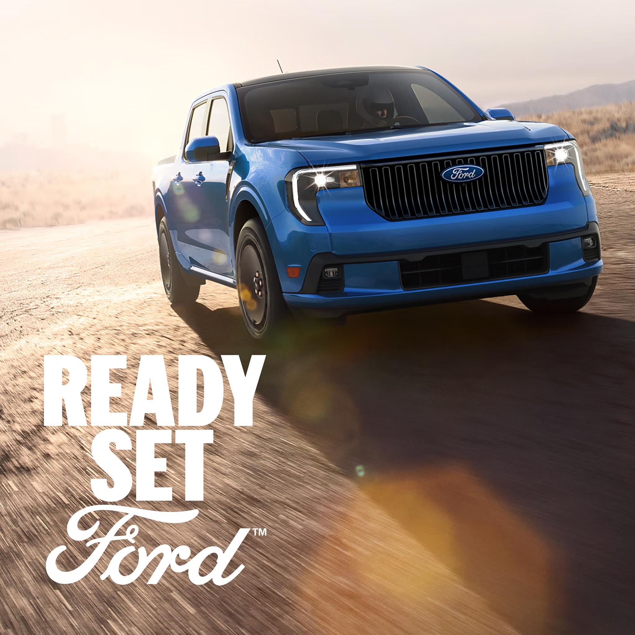 Blue Ford Maverick on a dirt road with the message Ready Set Ford