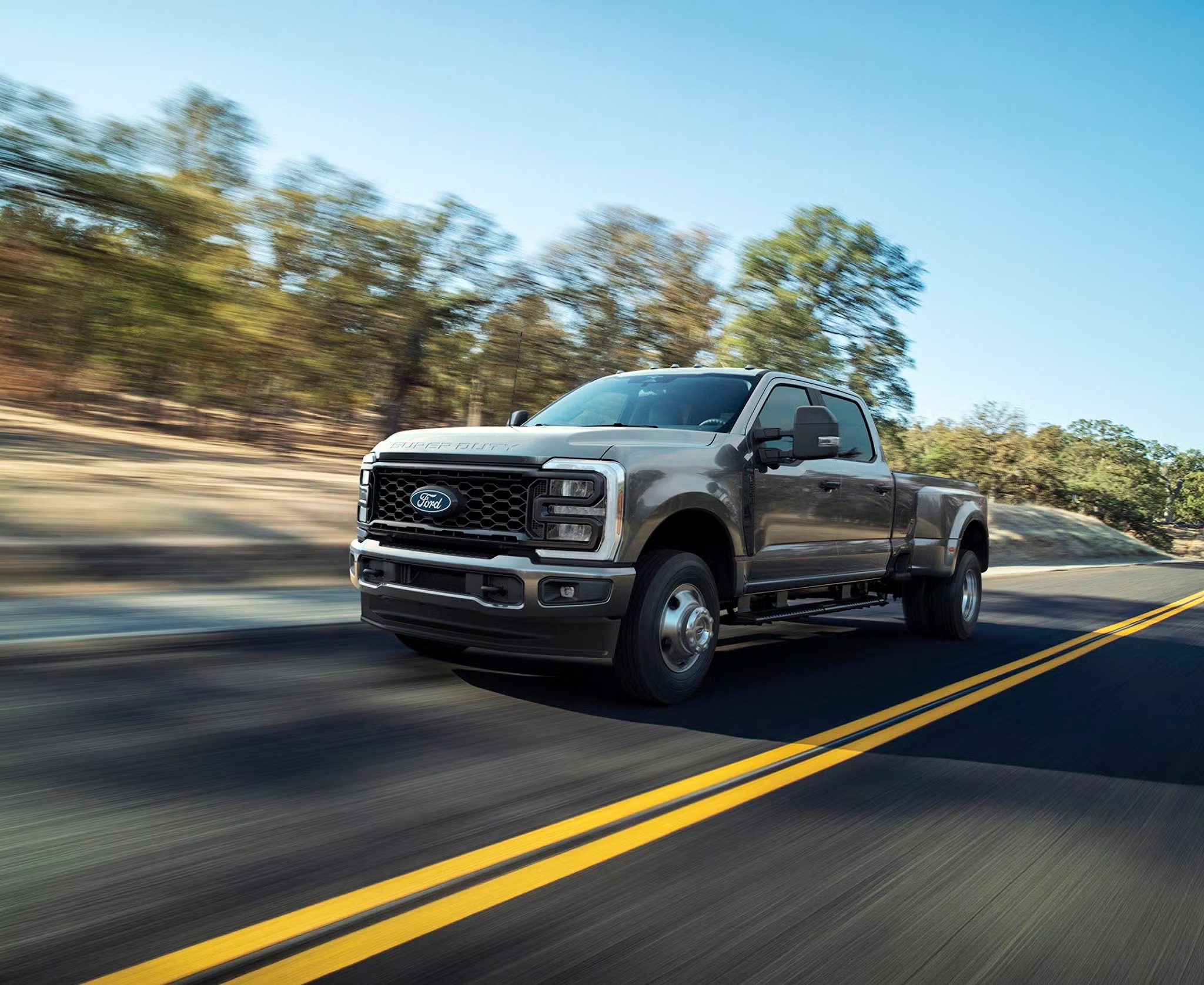Ford F-350 Super Duty dual-rear-wheel pickup driving on a highway