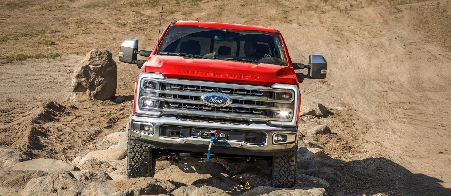 A red Ford Super Duty in the desert