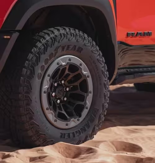 Ram TRX tire and wheel in desert sand