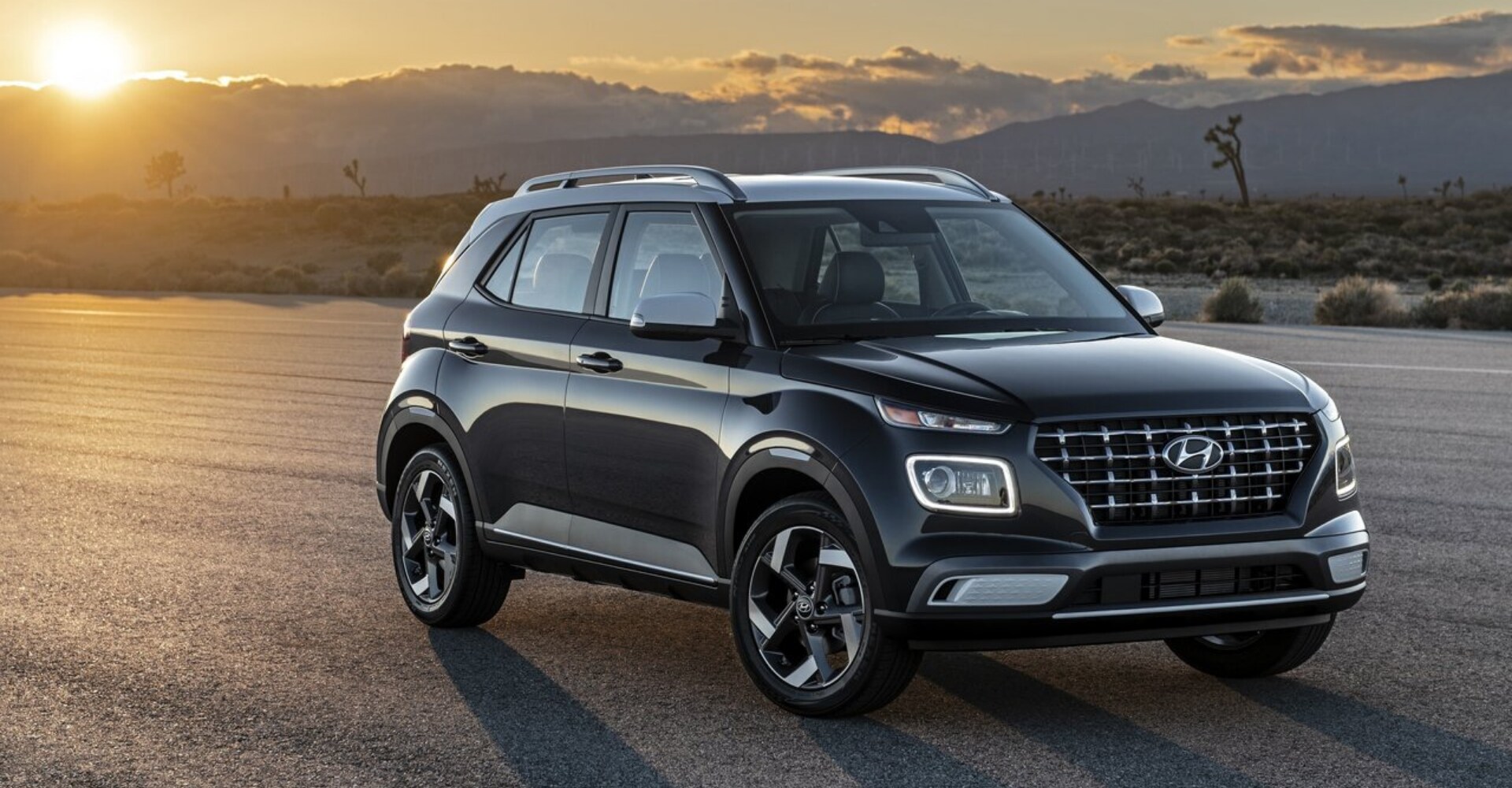 2020 Hyundai Venue parked on a cleared drag strip at sunset over mountains