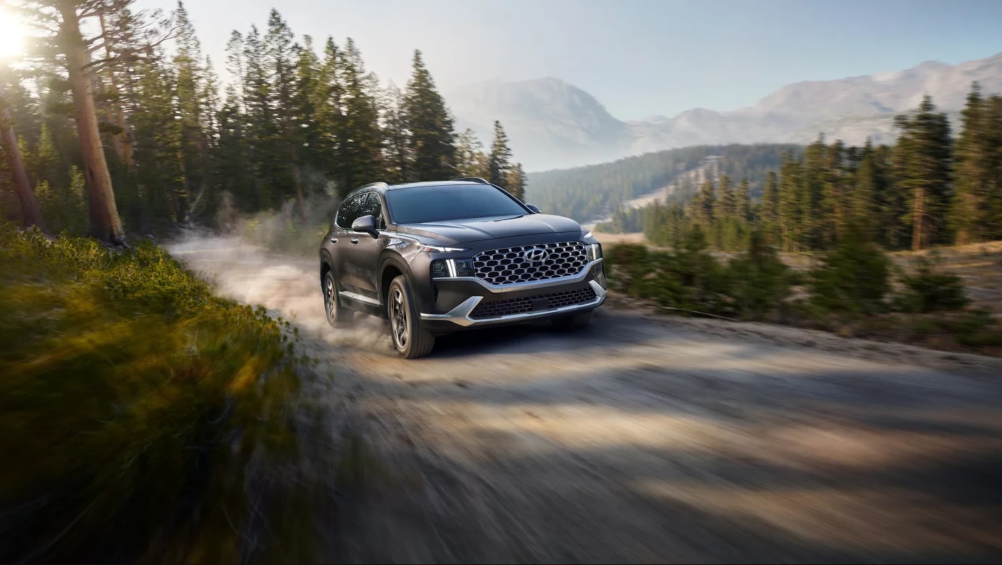 hyundai suv driving on mountain road