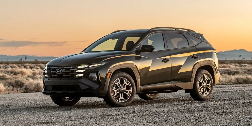 2026 TUCSON XRT front three-quarter at sunset