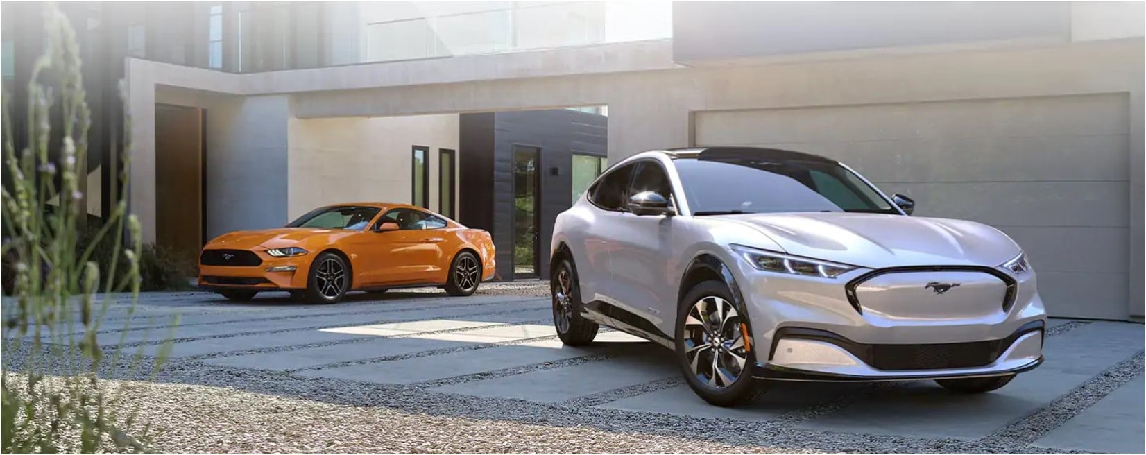 A 2020 Ford Mustang next to a 2021 Mustang Mach-E