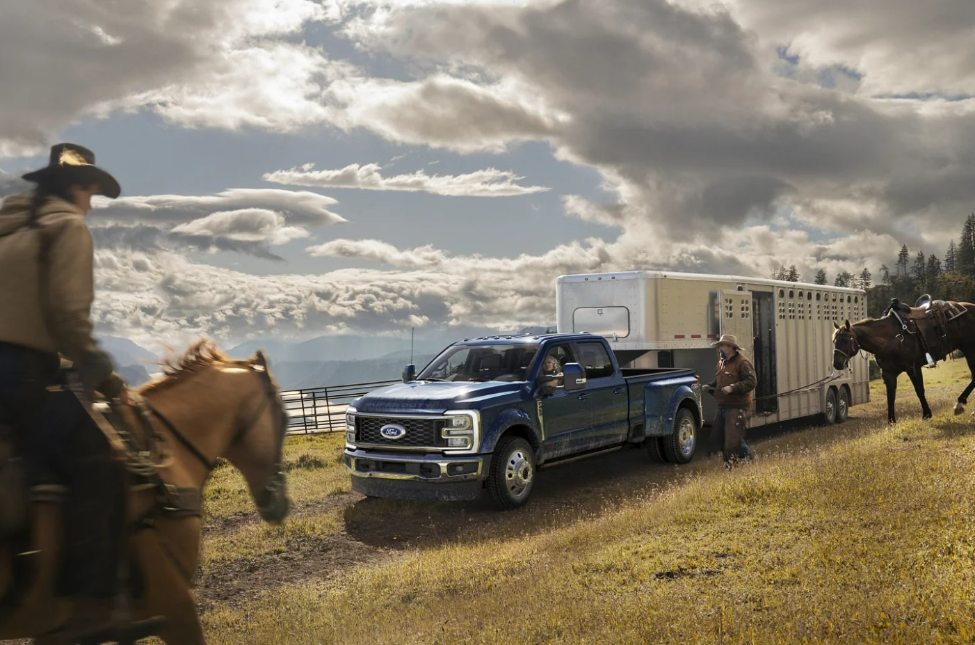 A Ford Super Duty truck pulling a horse trailer.