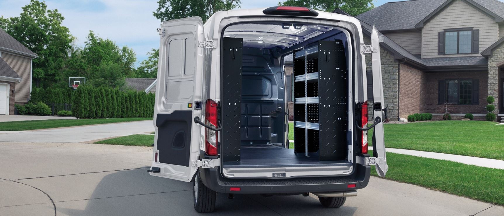 The back of a Ford Transit with nothing inside showing how much room is avalible..