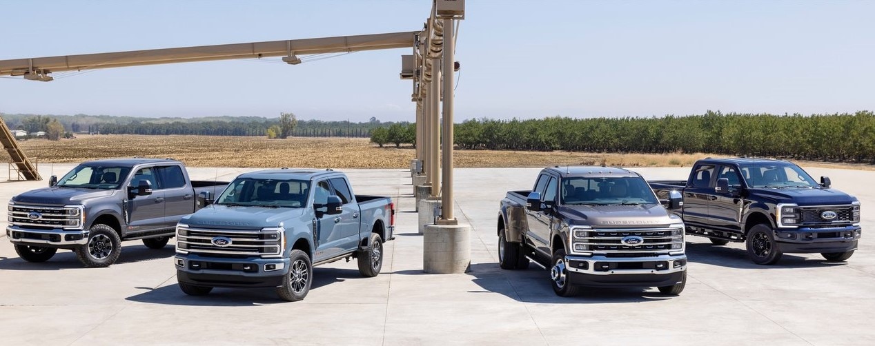 Four Ford Super Duty Trucks on Display with different towing packages.