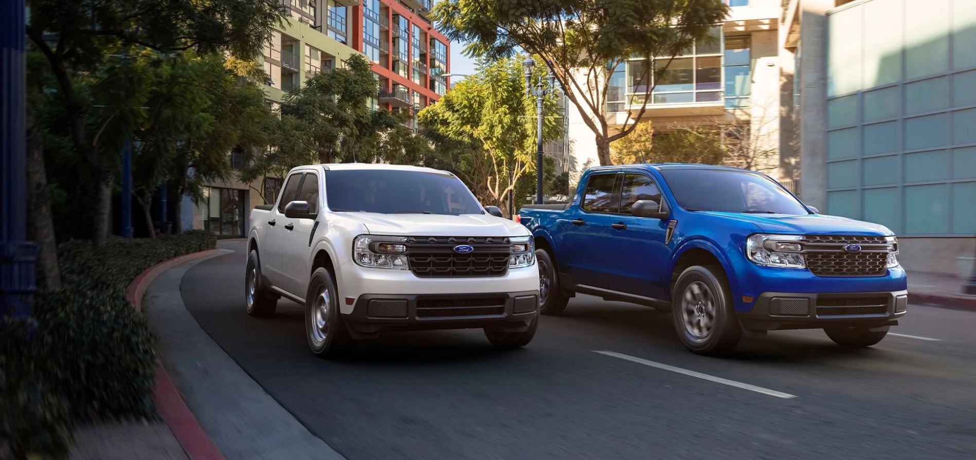 Two Ford Mavericks parked on a city street.
