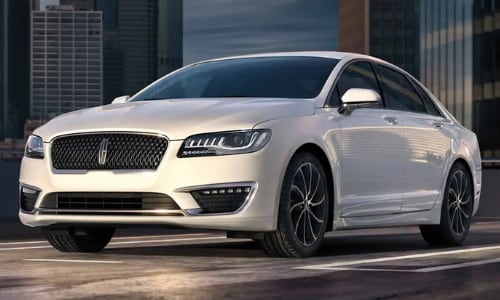 2020 Lincoln MKZ white parked top floor of city parking garage sunset skyscrapers background