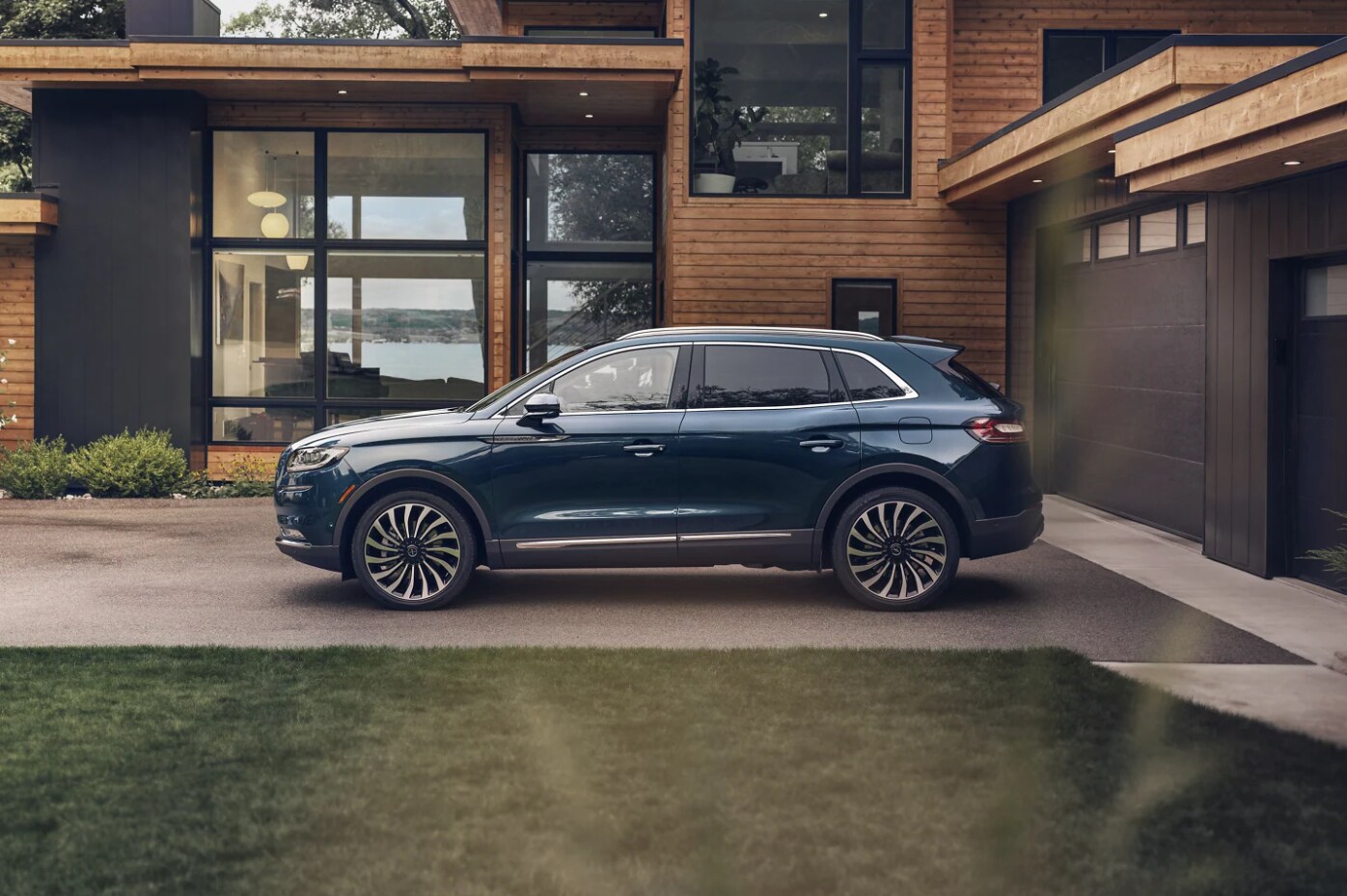 2023-lincoln-nautilus-sits-parked-in-the-driveway-of-a-modern-home