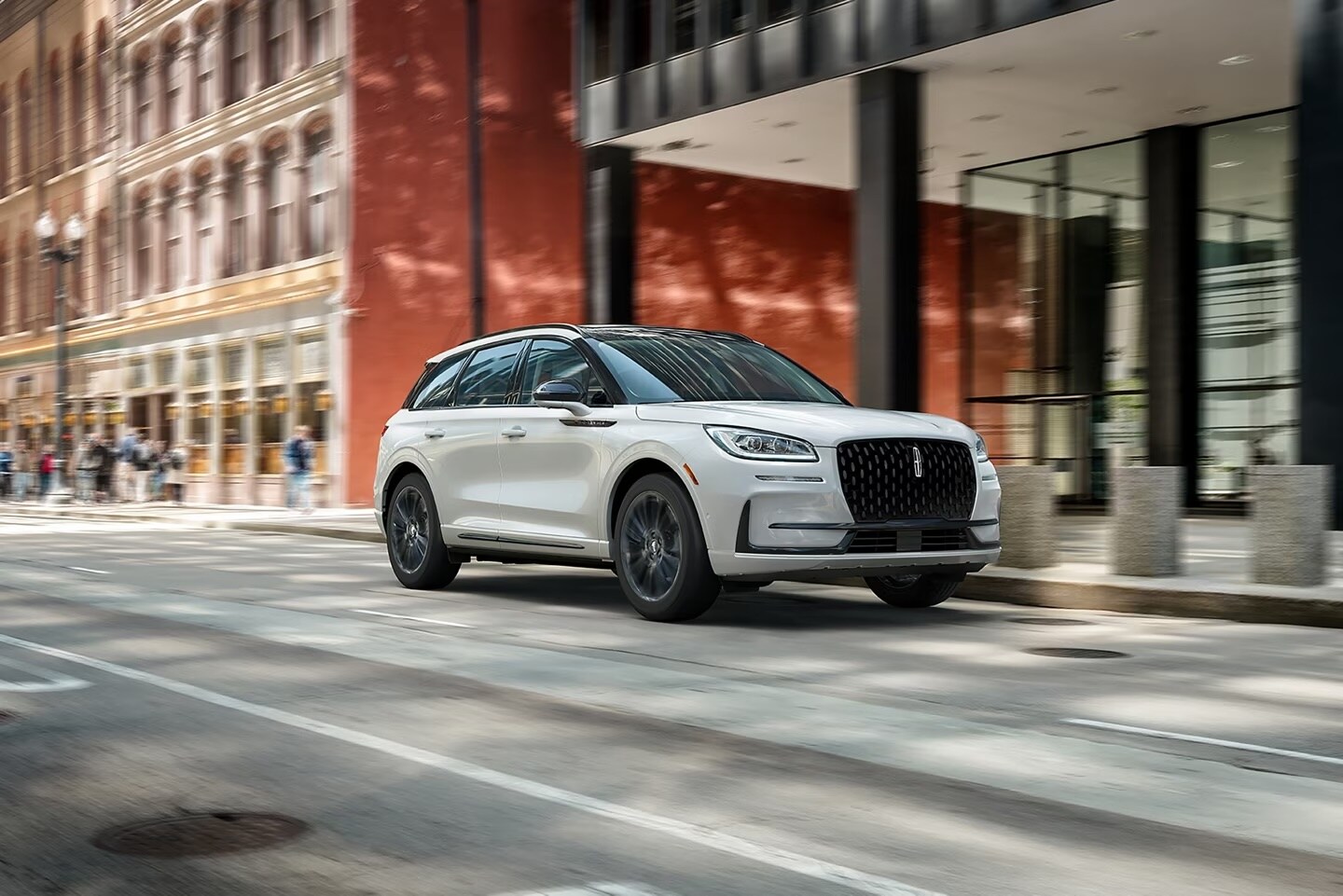 A Lincoln Corsair driving through city streets