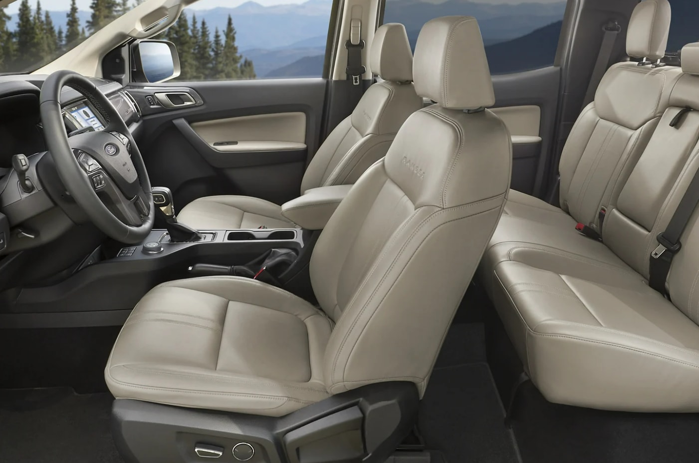 A view of the cabin and seating upholstered in cream leather of a 2023 Ford Ranger