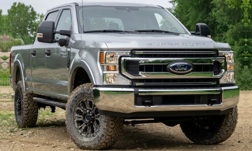 2020 Ford Super Duty silver front exterior muddy tires forest