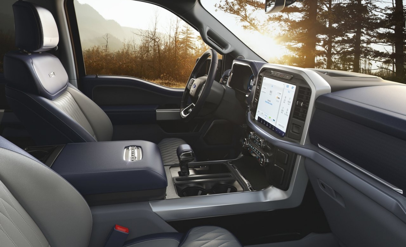 Front interior seating and dashboard inside the 2021 Ford F-150 Limited SuperCrew truck