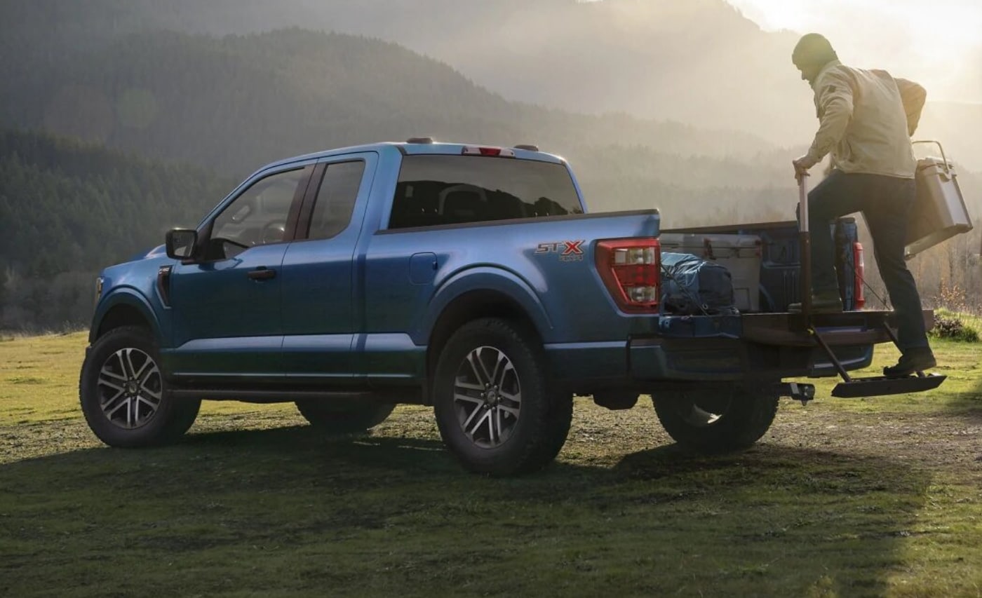 Rear exterior view of a blue 2021 Ford F-150 SuperCab truck